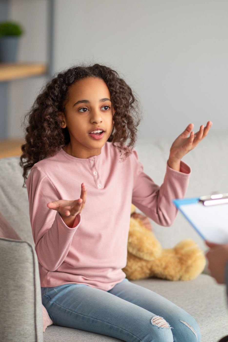 A child talking to a therapist about autism.